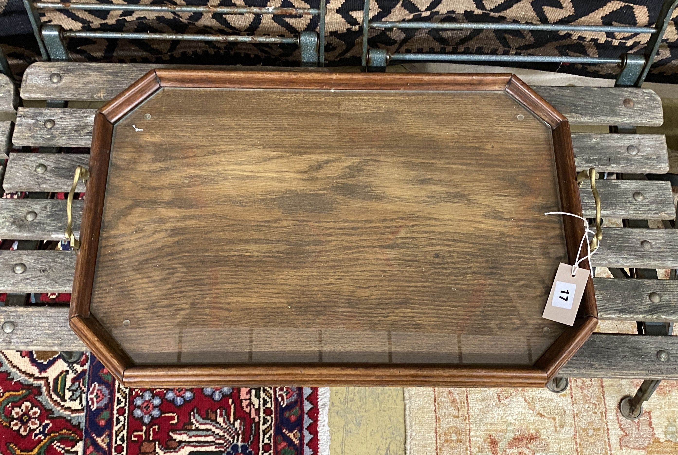 An Edwardian octagonal oak twin handled tray, length 62cm, depth 40cm